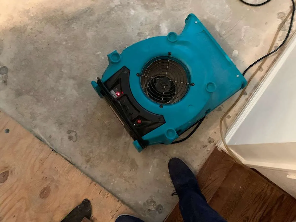 Air mover drying subfloor during Leak Detection & Repair in Seneca Falls